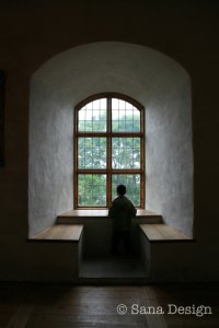 A Child watching through a Castle Window